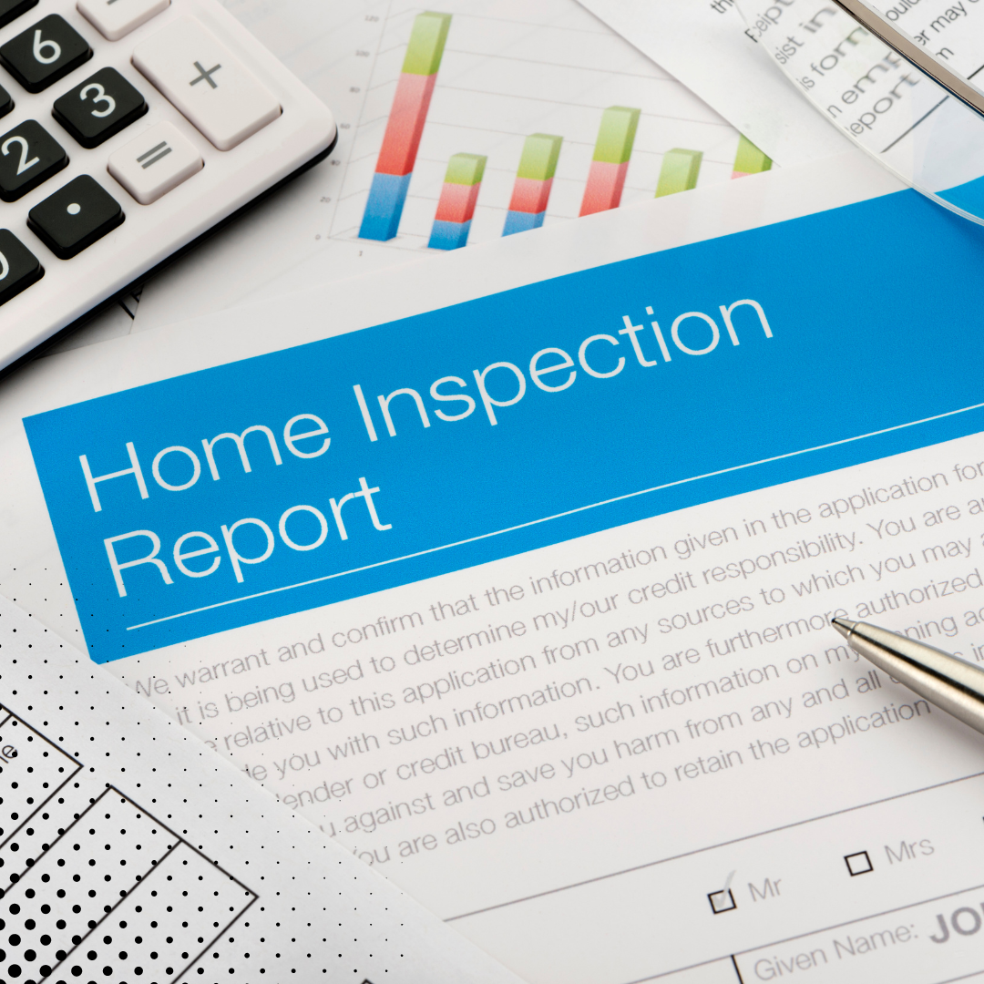 The "Home Inspection Report" alongside a pen, calculator, and financial spreadsheets. 